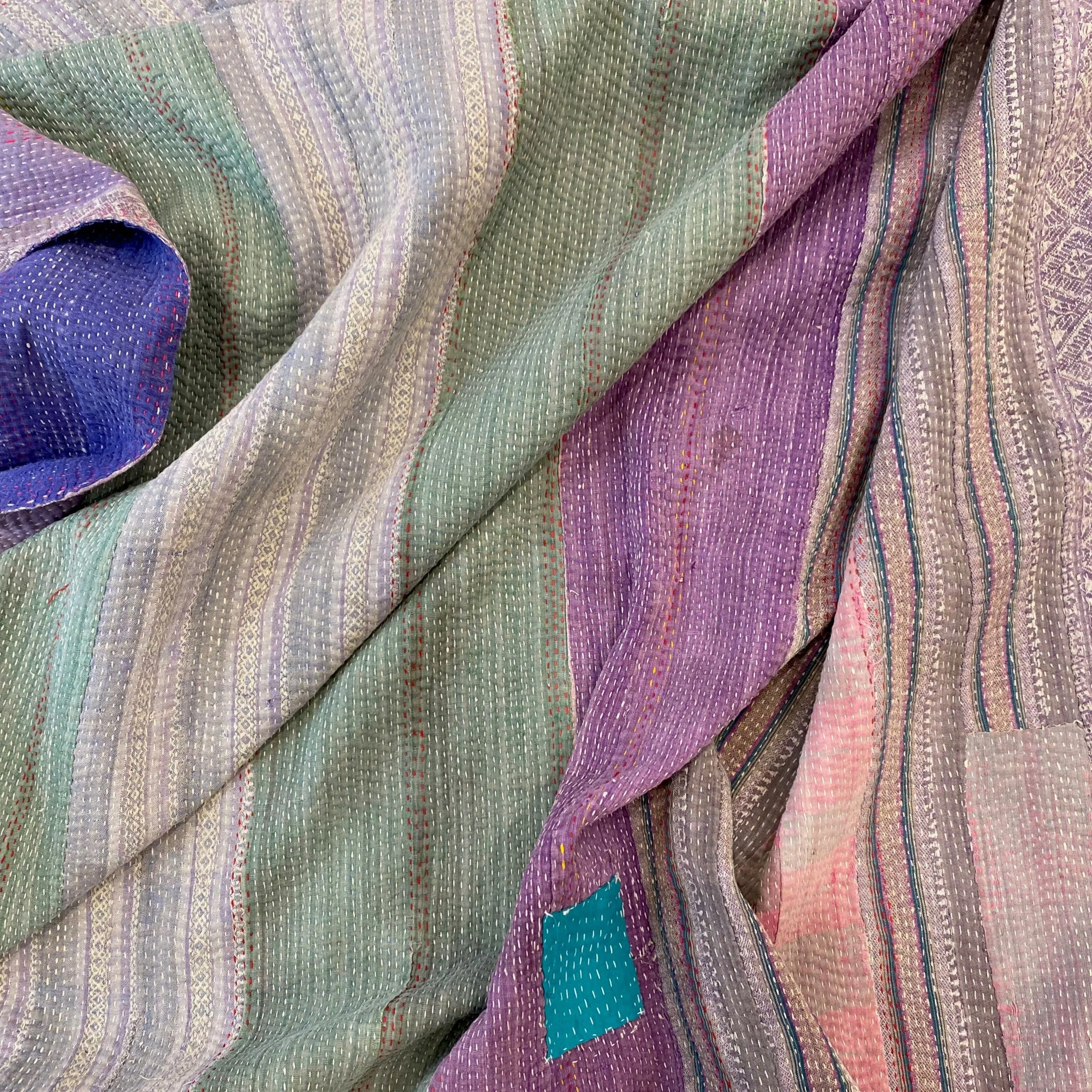 Vintage Kantha with a muted soft side and a dramatic purple side.